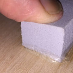 A piece of rubber glued to a rotary board with too much glue