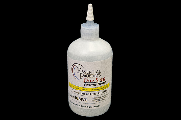 A bottle of low viscosity diemaking adhesive