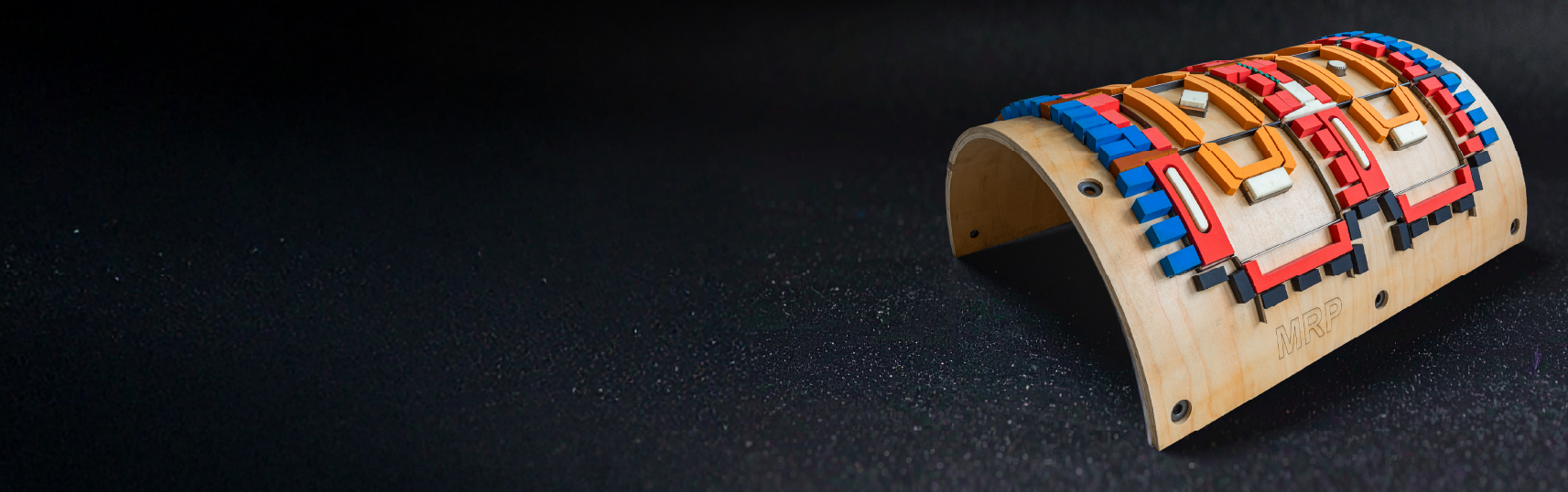 Monroe ejection products on a rotary dieboard dark background